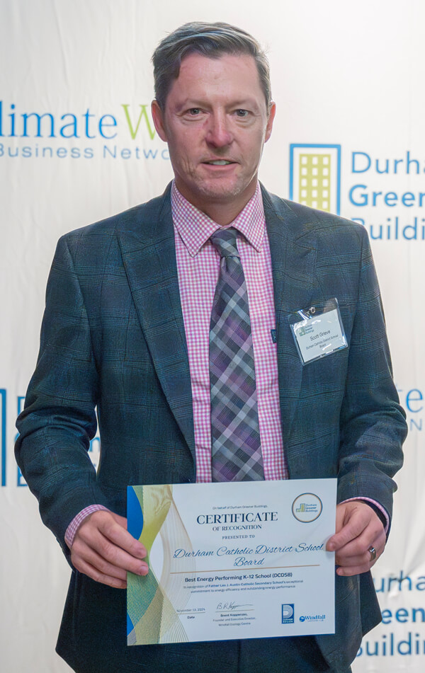Representative of Durham Catholic District School Board receiving award at Durham Greener Homes Evening of Recognition