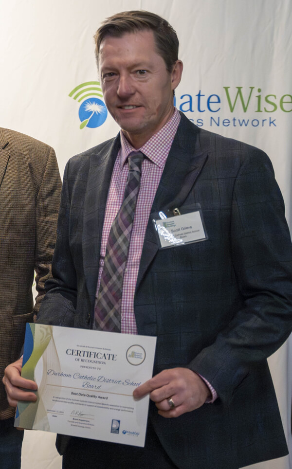 Representative of Durham Catholic District School Board receiving award at Durham Greener Homes Evening of Recognition