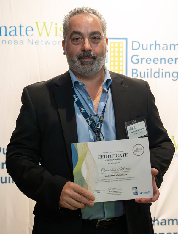 Representative of Brock receiving award at Durham Greener Homes Evening of Recognition