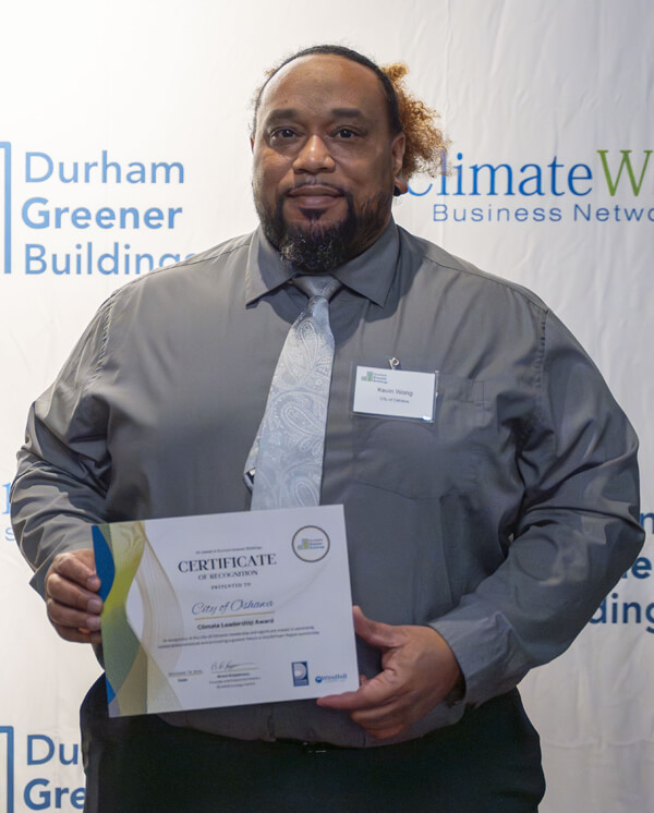 Representative of Oshawa receiving award at Durham Greener Homes Evening of Recognition